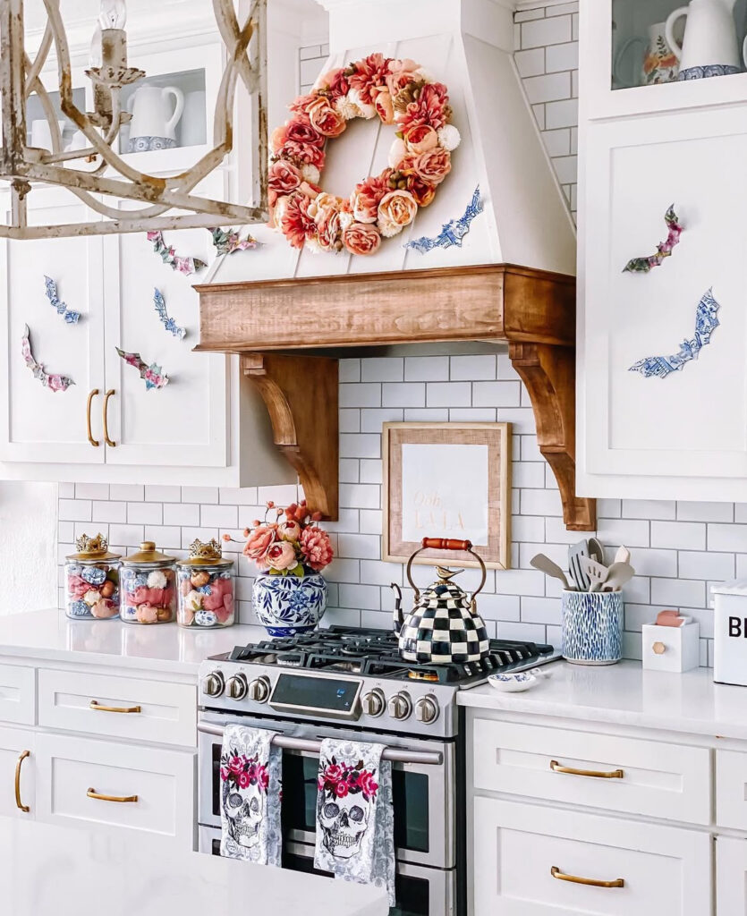 Floral-goth range scene with a peony wreath on the hood, floral bat decals, and skull tea towels.