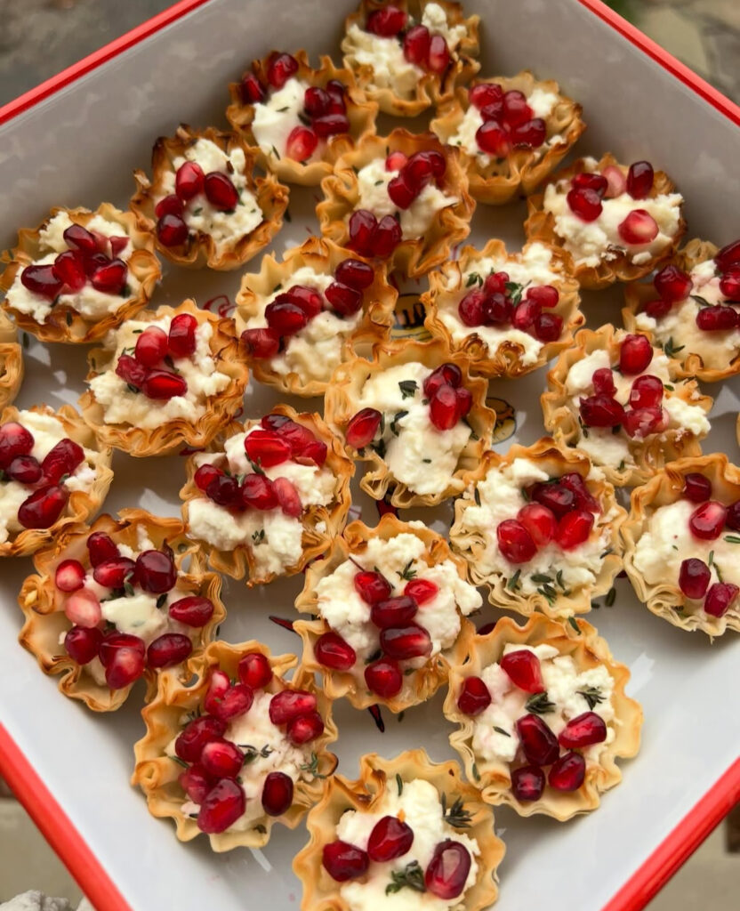 Crisp phyllo shells filled with whipped feta and crowned with shiny pomegranate arils.