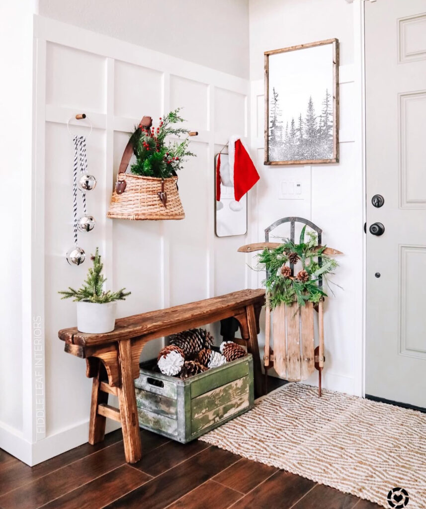Alpine cabin inspired entryway with rustic Christmas greenery