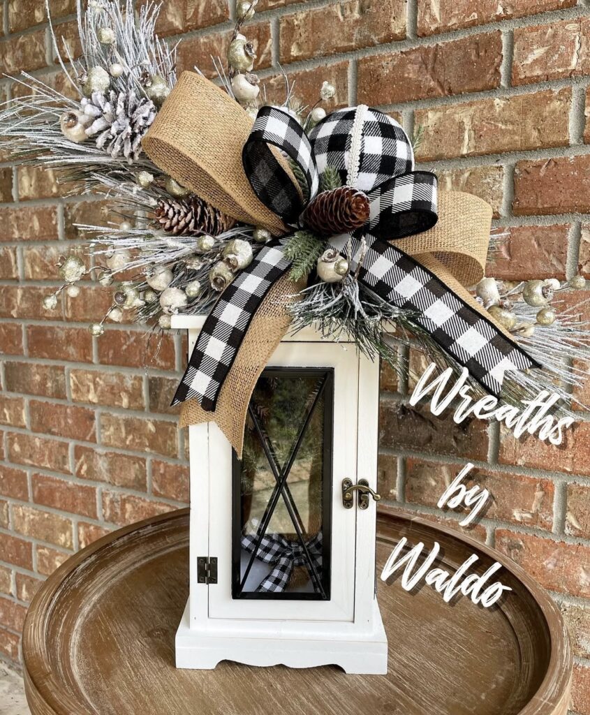 Black and white lantern decorated with a bold bow