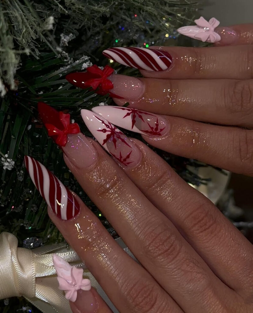 3D bows and candy cane striped nails with snowflakes