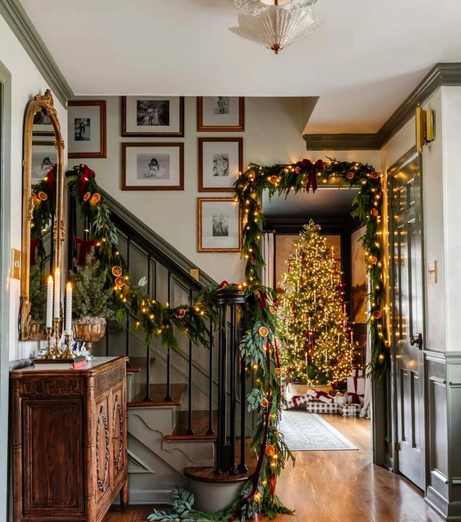 Candlelit archway decorated with citrus garlands