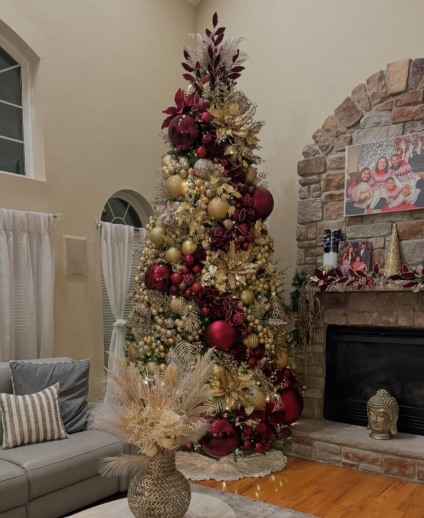 Burgundy and gold Christmas tree with chateau-inspired accents