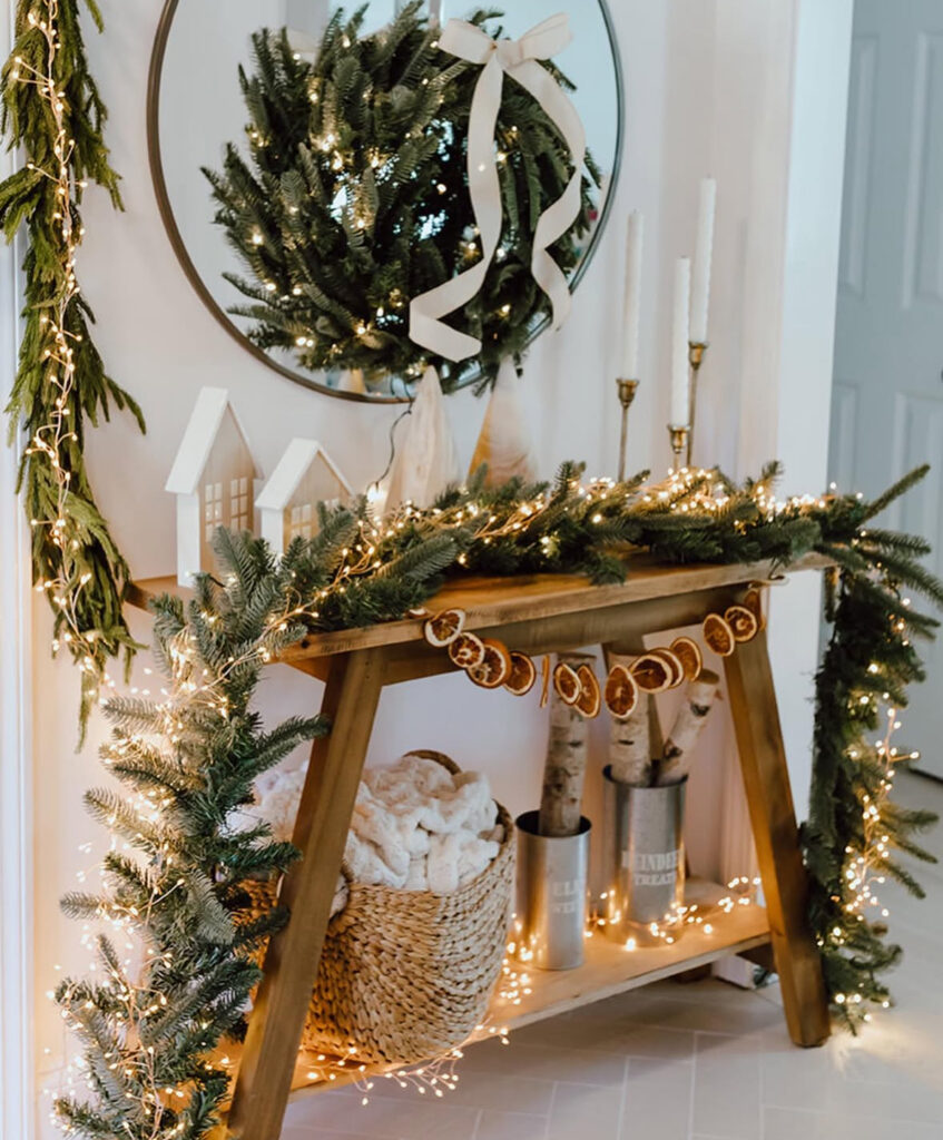Entryway decorated with citrus garlands and twinkle lights