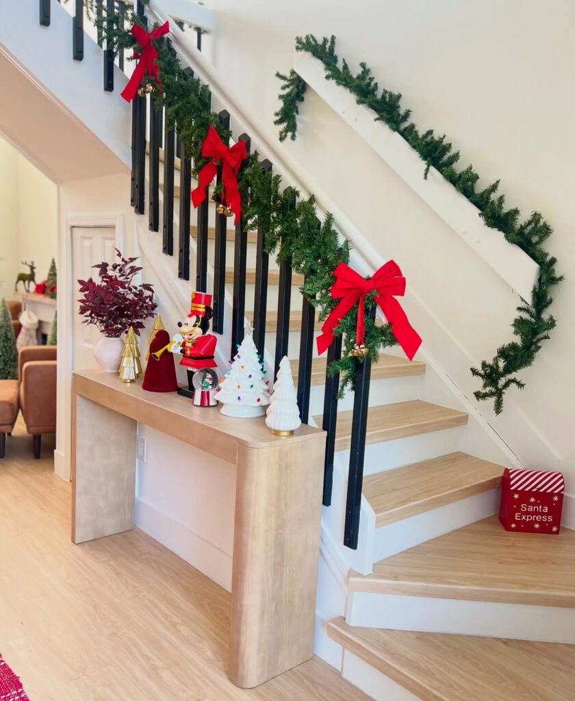 Minimal entry with clean lines and red holiday bows