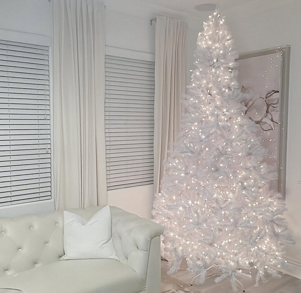 Minimal pre-lit all-white tree—clean, modern white christmas tree ideas.