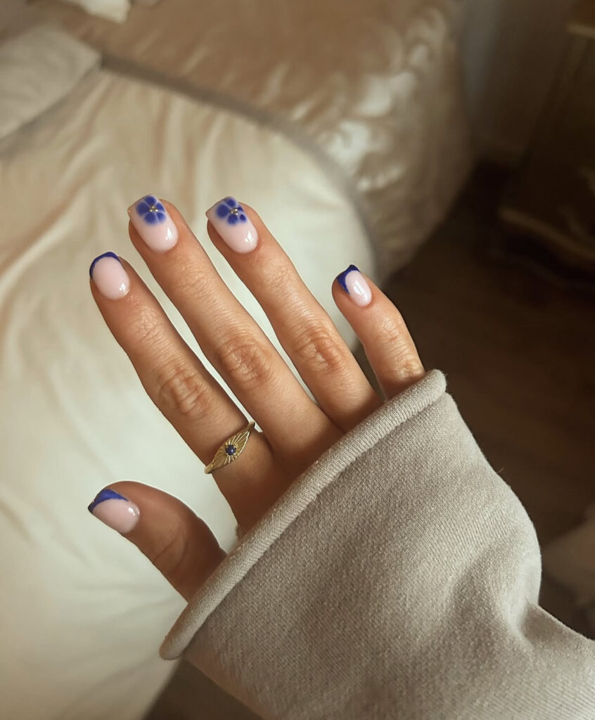 Cobalt daisy French tip nail design