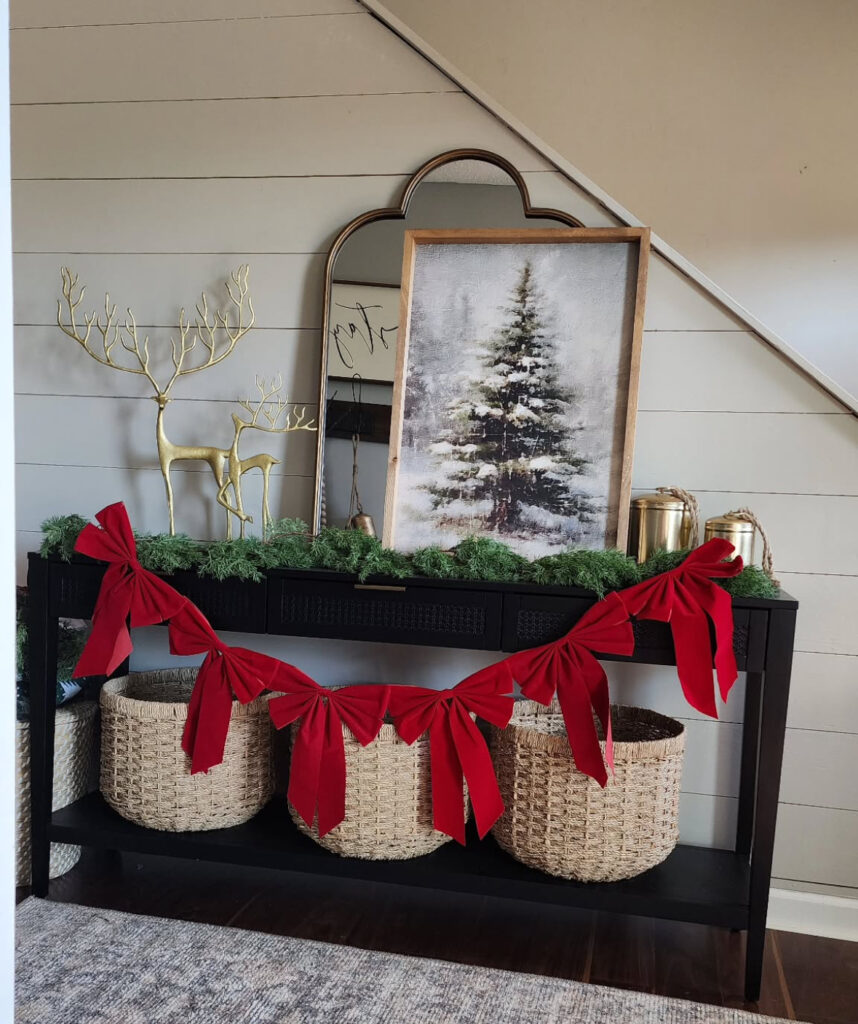 Console table with oversized holiday bows as the focal point