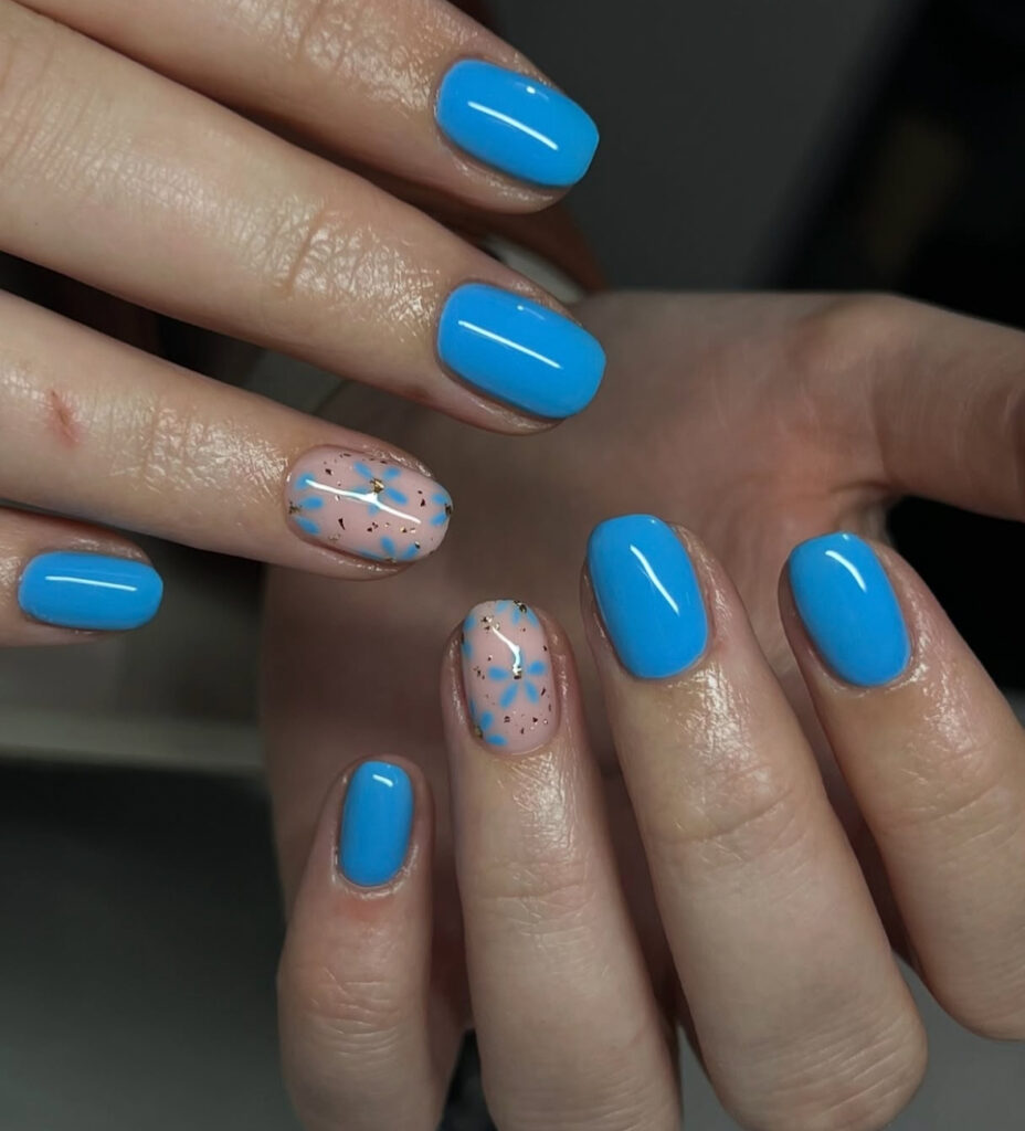 Electric blue nails with confetti accent