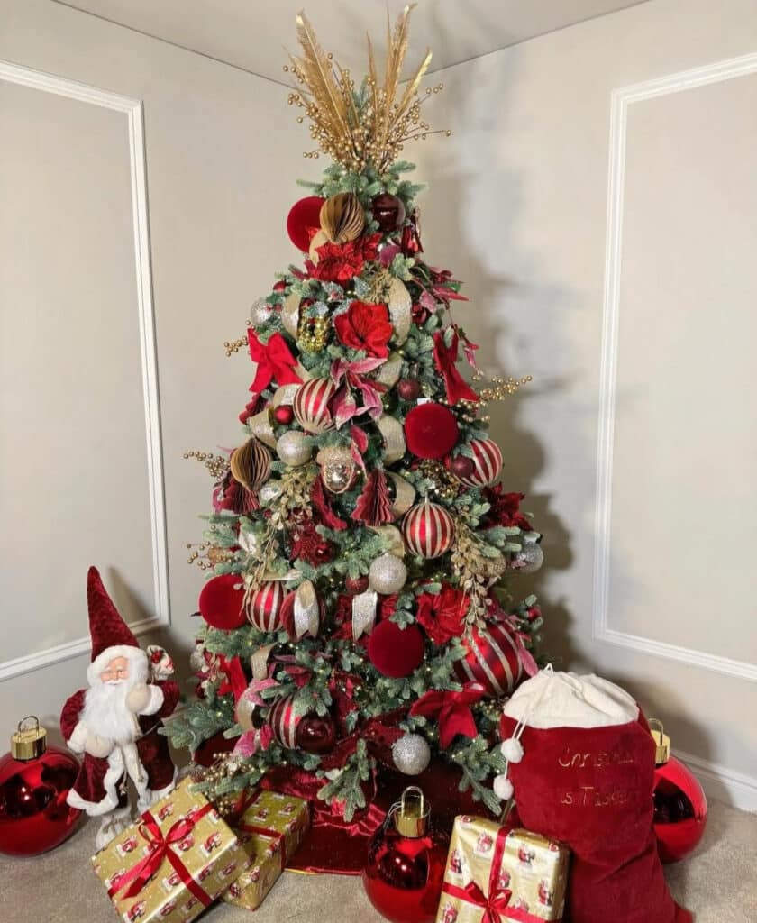 Elegant burgundy Christmas tree with grand hotel–style gold accents