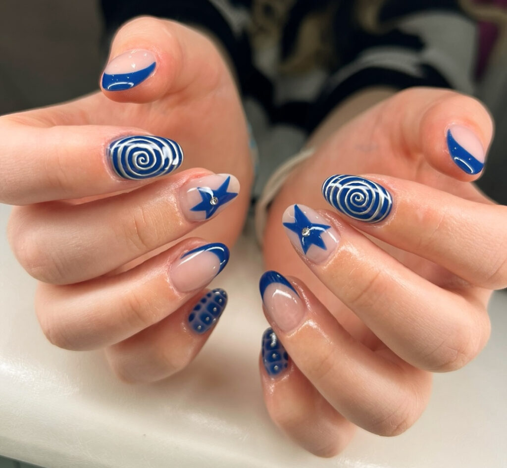 Indigo swirl nails with stars and dots