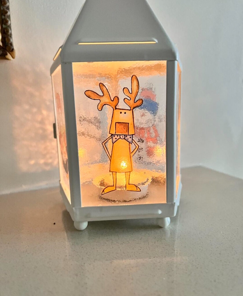 DIY Lantern decorated with kid-drawn reindeer artwork
