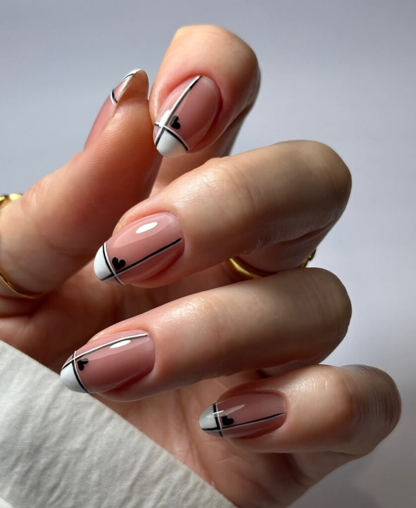Minimal line art nails with tiny hearts