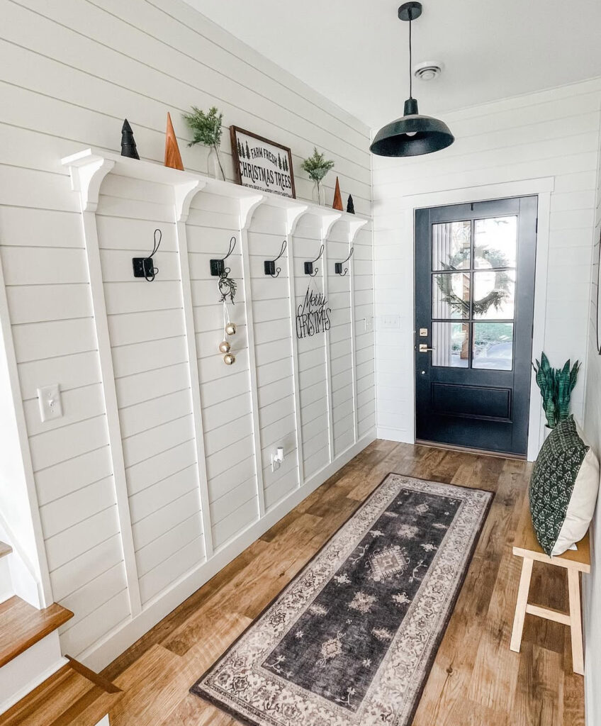 Minimal mudroom decorated with bright Christmas cheer