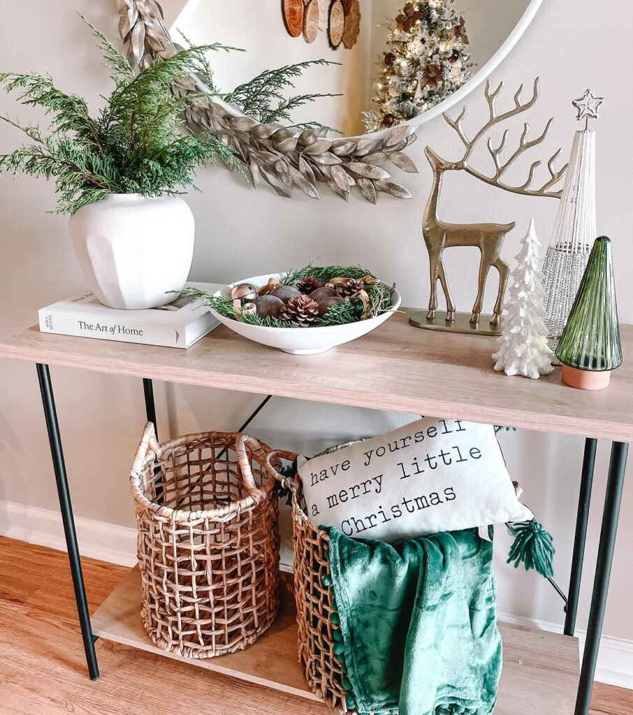 Minimal console decorated with meadow greenery and warm winter accents