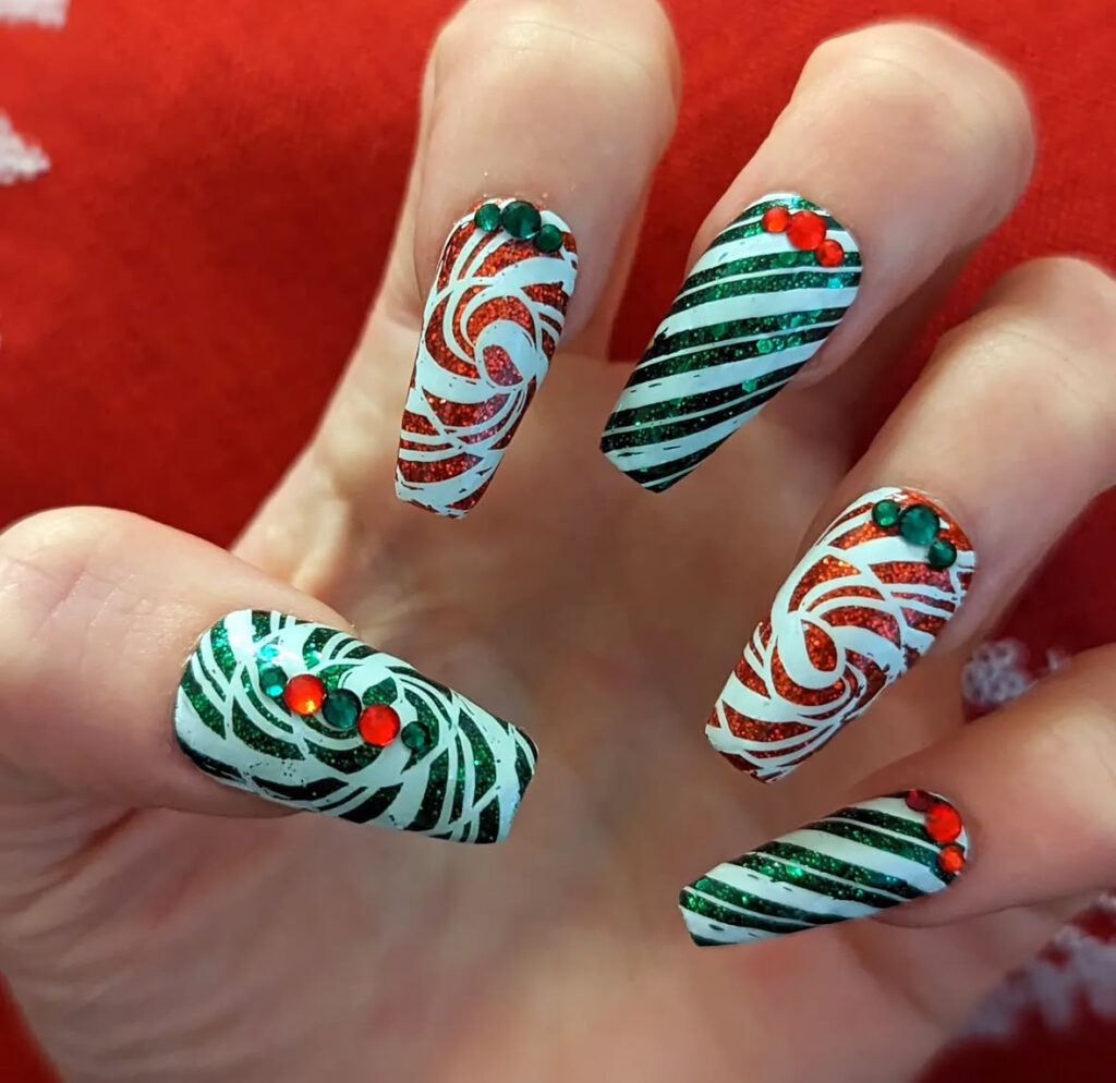 Holiday ornament-themed nail art with red and white details