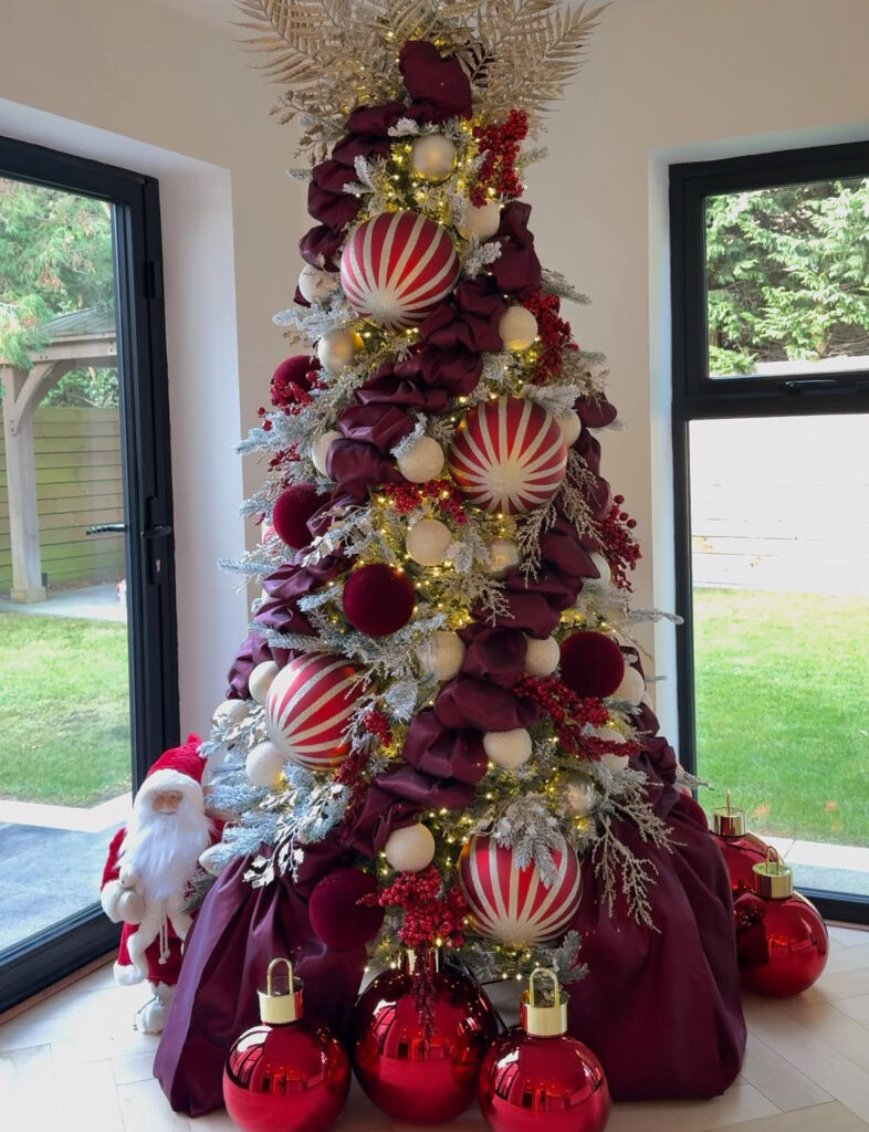 Burgundy Christmas tree with peppermint velvet ribbons
