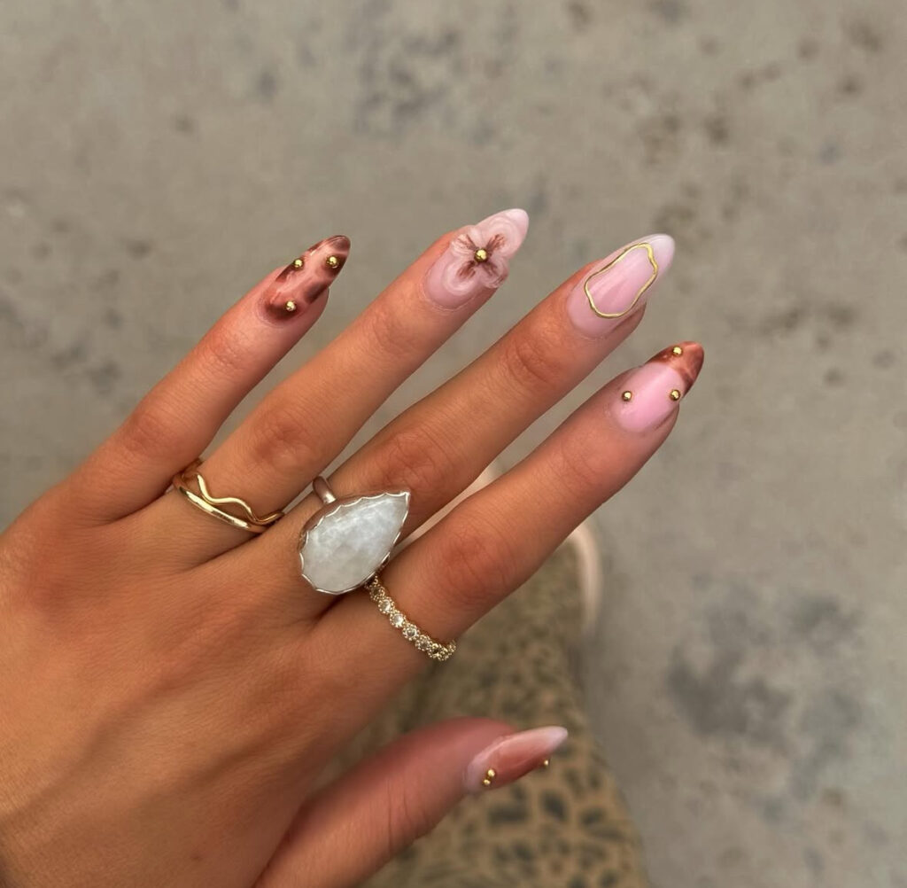 Sculpted petal nails with gold stud details