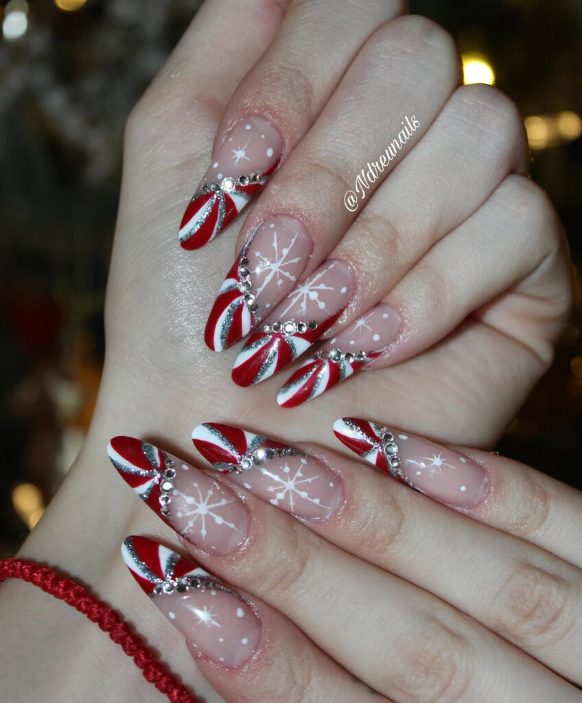 Snowflake and candy cane stripe nail design