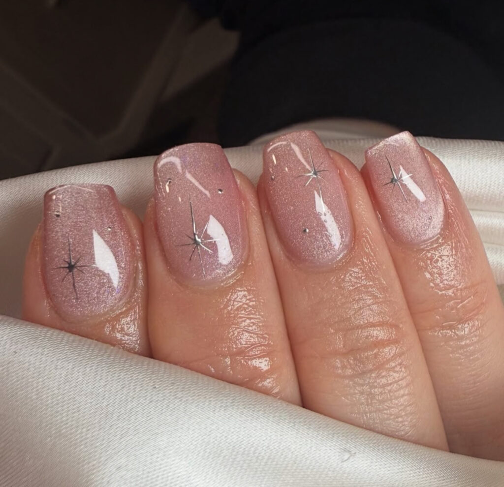 Short rosy nails with subtle stardust shimmer