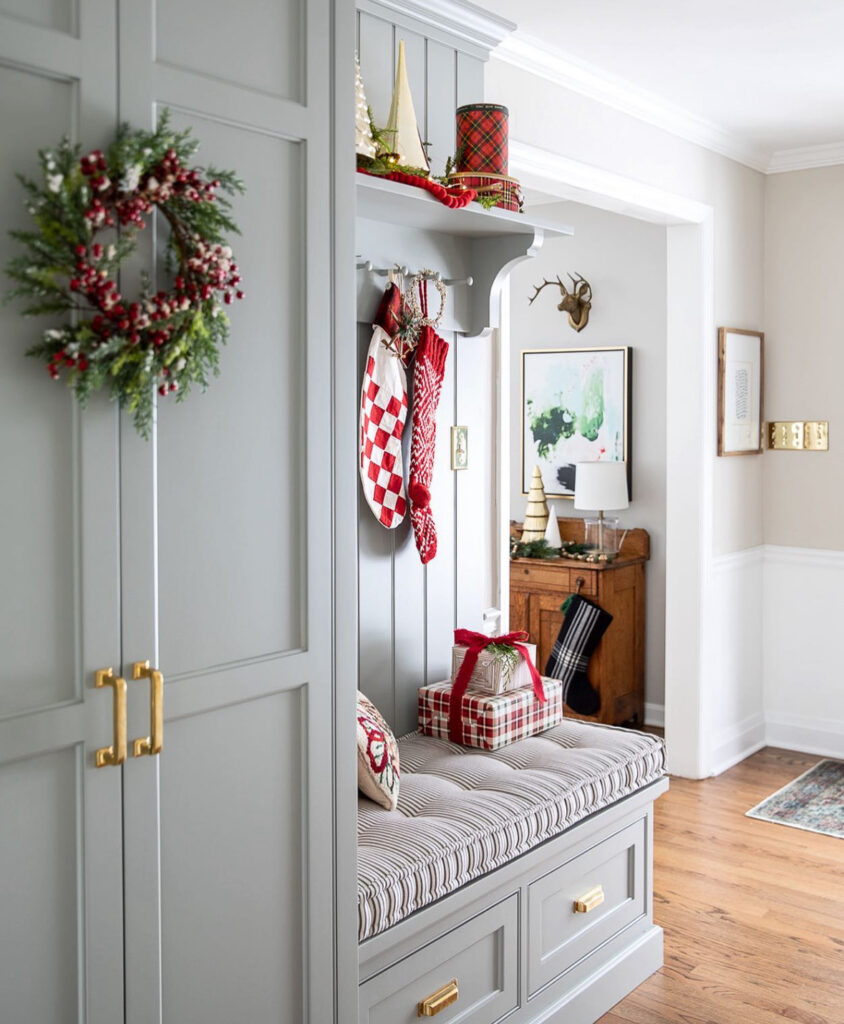 Tailored mudroom with cheerful Christmas accents and neutral stockings