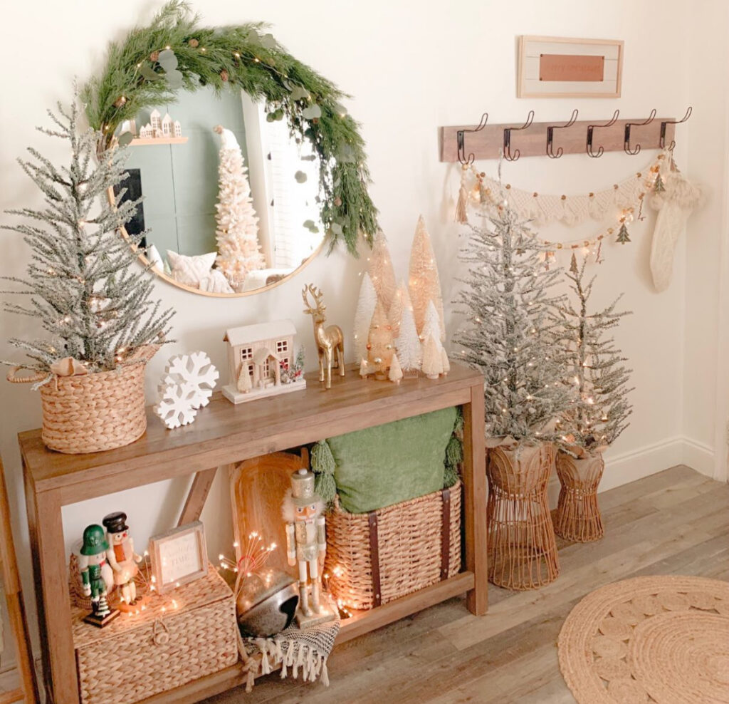 entry console with mini trees and mirror in bohemian Christmas decor