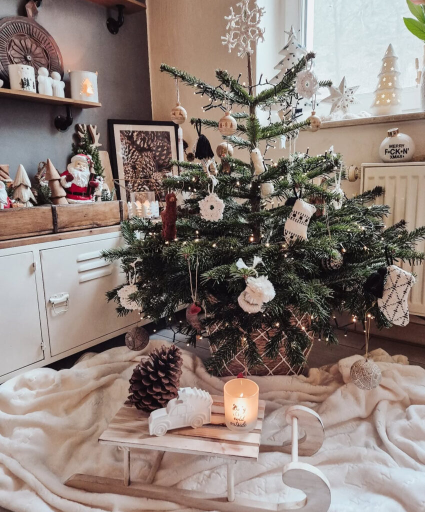 handmade ornaments and a cozy blanket in boho Christmas decor