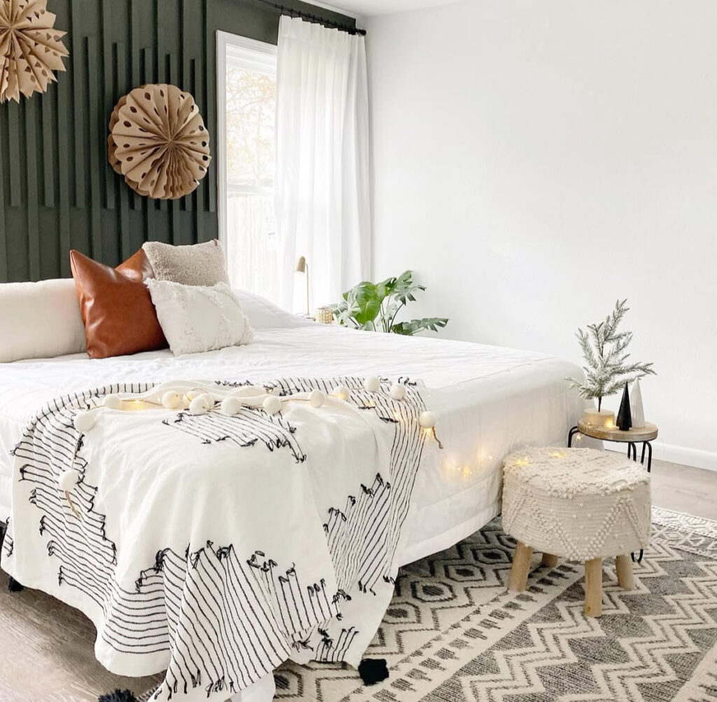 minimal bedroom with fairy lights and boho Christmas decor