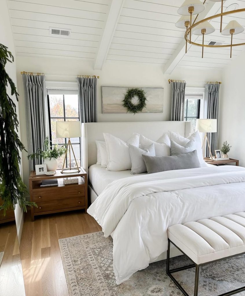 minimalist Christmas bedroom with wreath over the bed