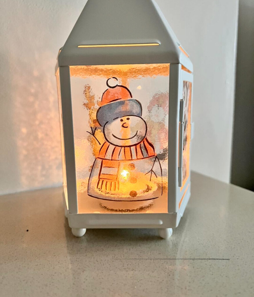 DIY Christmas lantern with candles and greenery