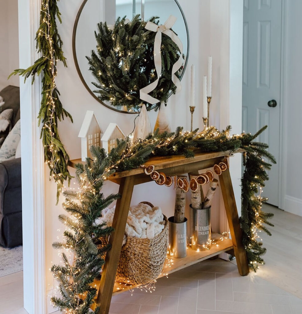 rustic entry console with Scandinavian Christmas garland