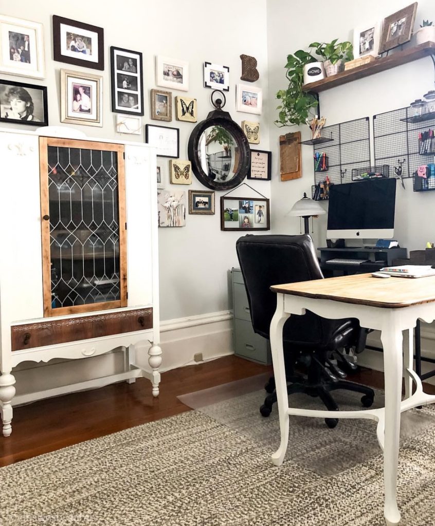 Farmhouse home office with a gallery wall and library shelving