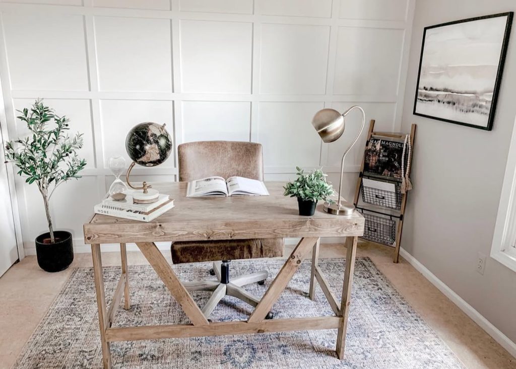Farmhouse home office featuring a decorative panel wall