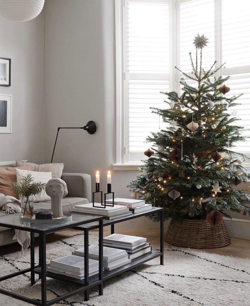 cozy minimalist Christmas tree in a neutral corner