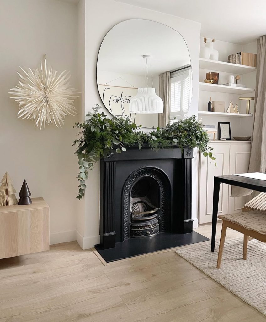 minimalist fireplace with garland and simple accents