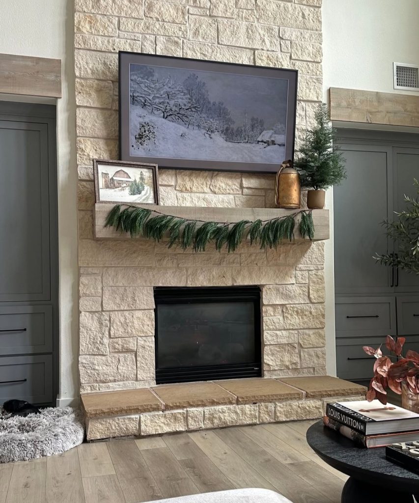 stone fireplace mantel with simple minimalist Christmas decor