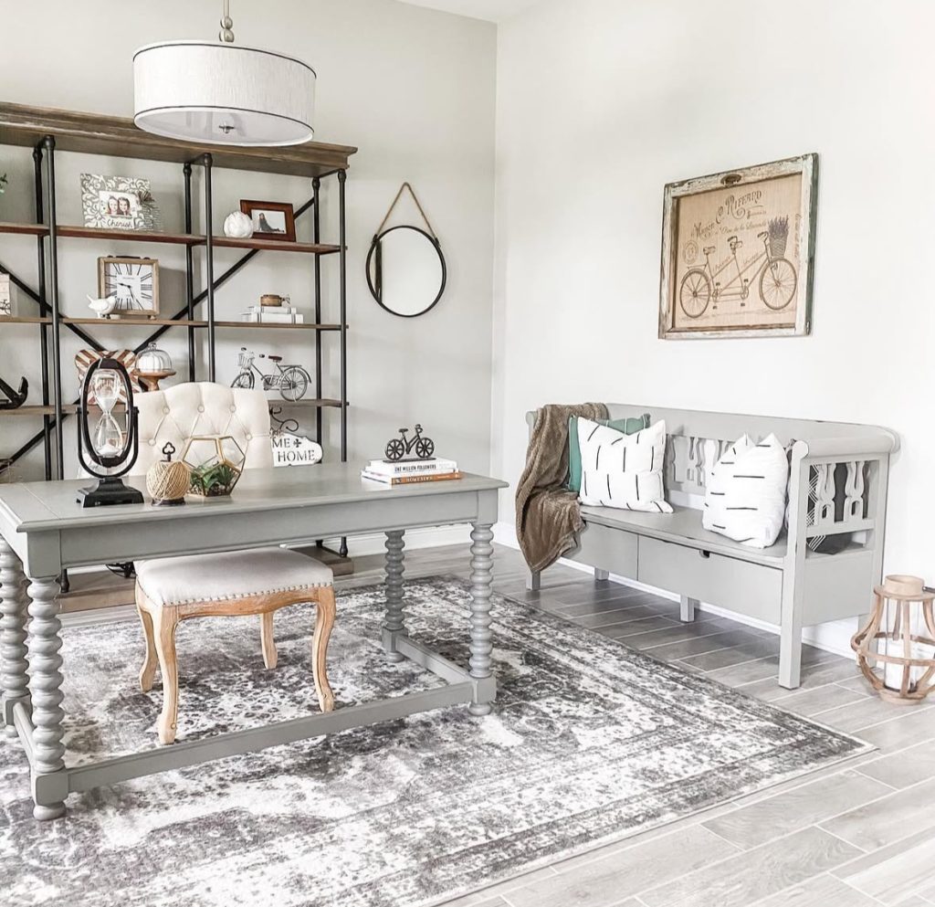Modern farmhouse office with gray walls and open shelving