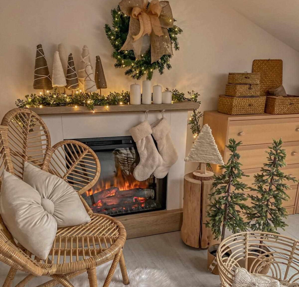 rattan chairs and fireplace with stockings in rustic boho Christmas decor