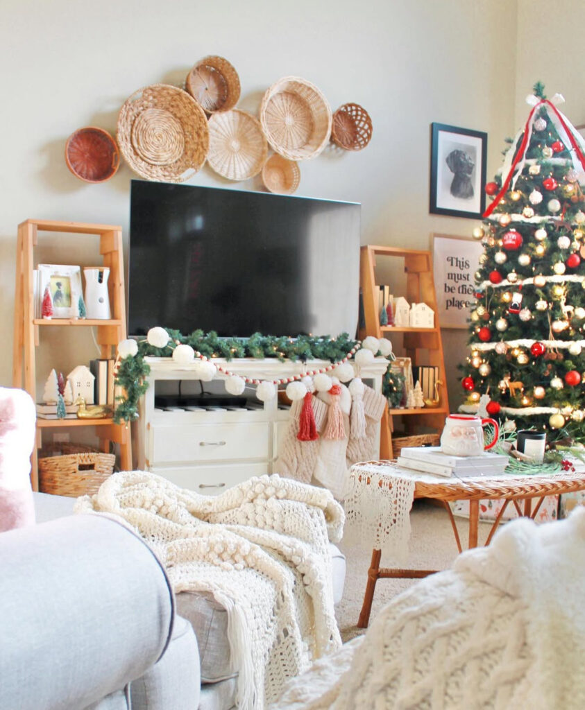 TV wall with baskets and garland in rustic boho Christmas decor