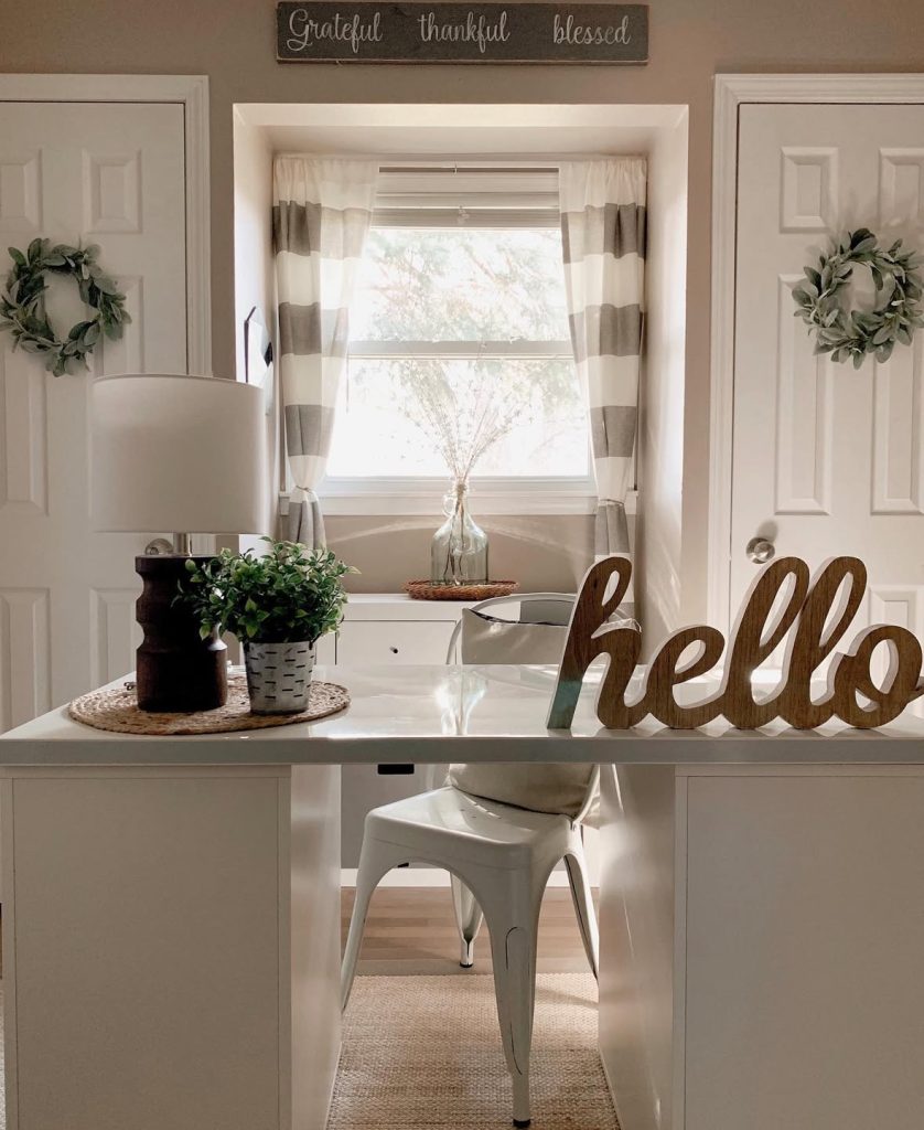 Rustic farmhouse office nook with a warm greeting sign