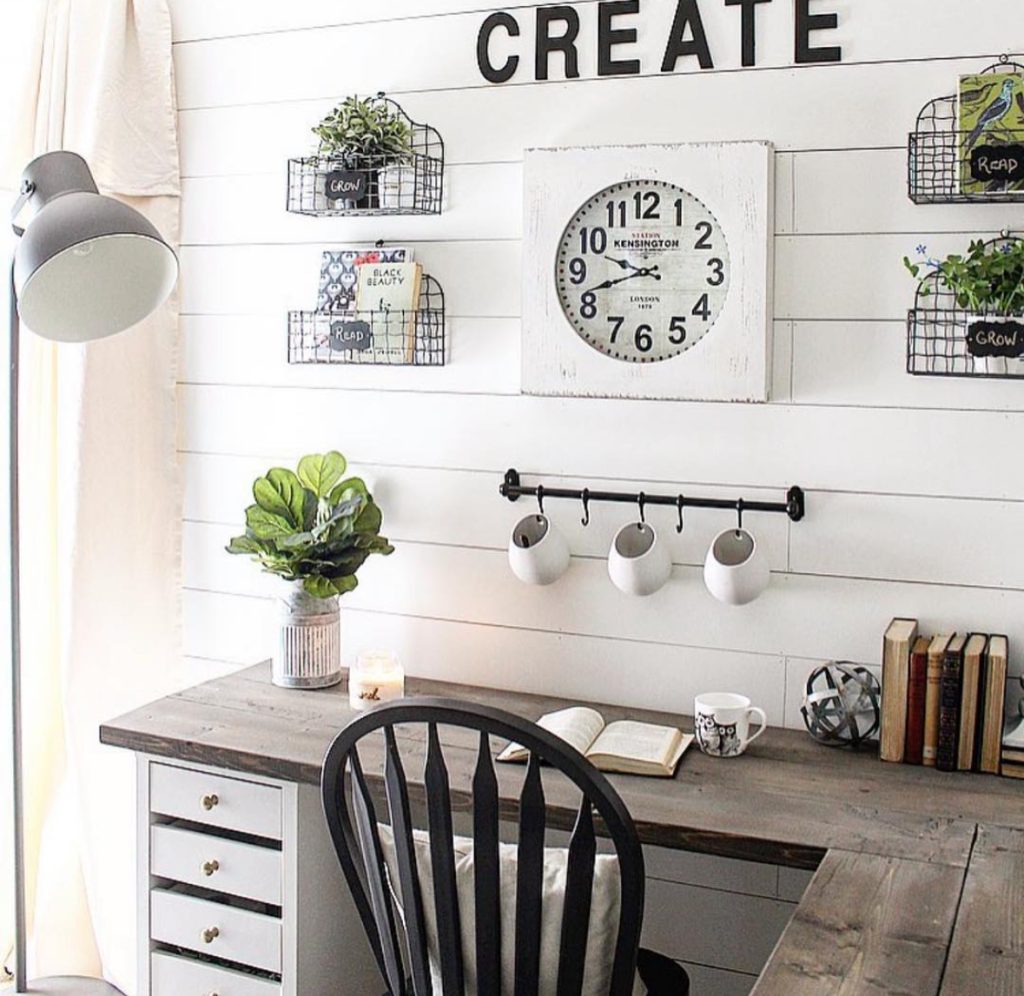 Small farmhouse office with a white shiplap wall and “create” sign