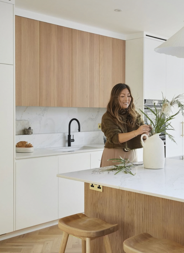 Bright Japandi kitchen showcasing natural wood finishes and soft neutral tones.
