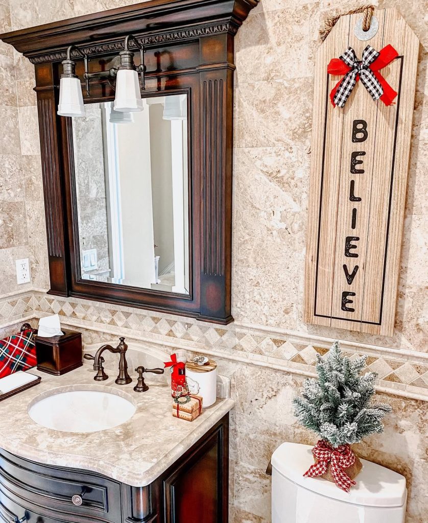 Bathroom decorated with a “Believe” Christmas sign