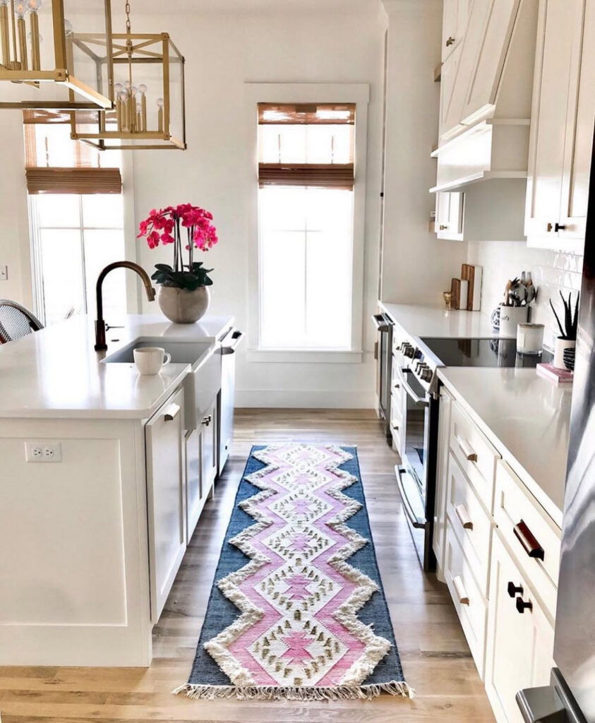 white galley layout with bold patterned runner brass lanterns stylish small lake house kitchen