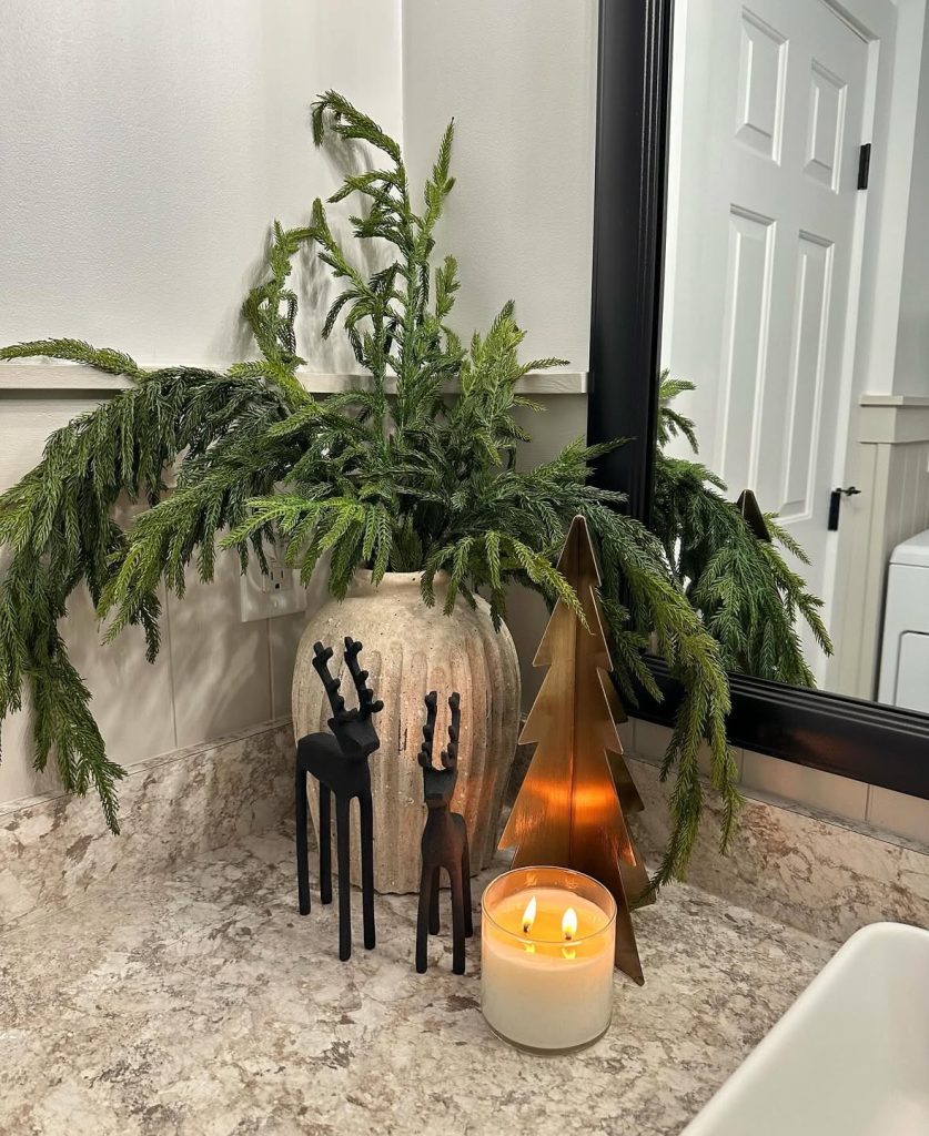 Christmas bathroom countertop vignette with festive accessories