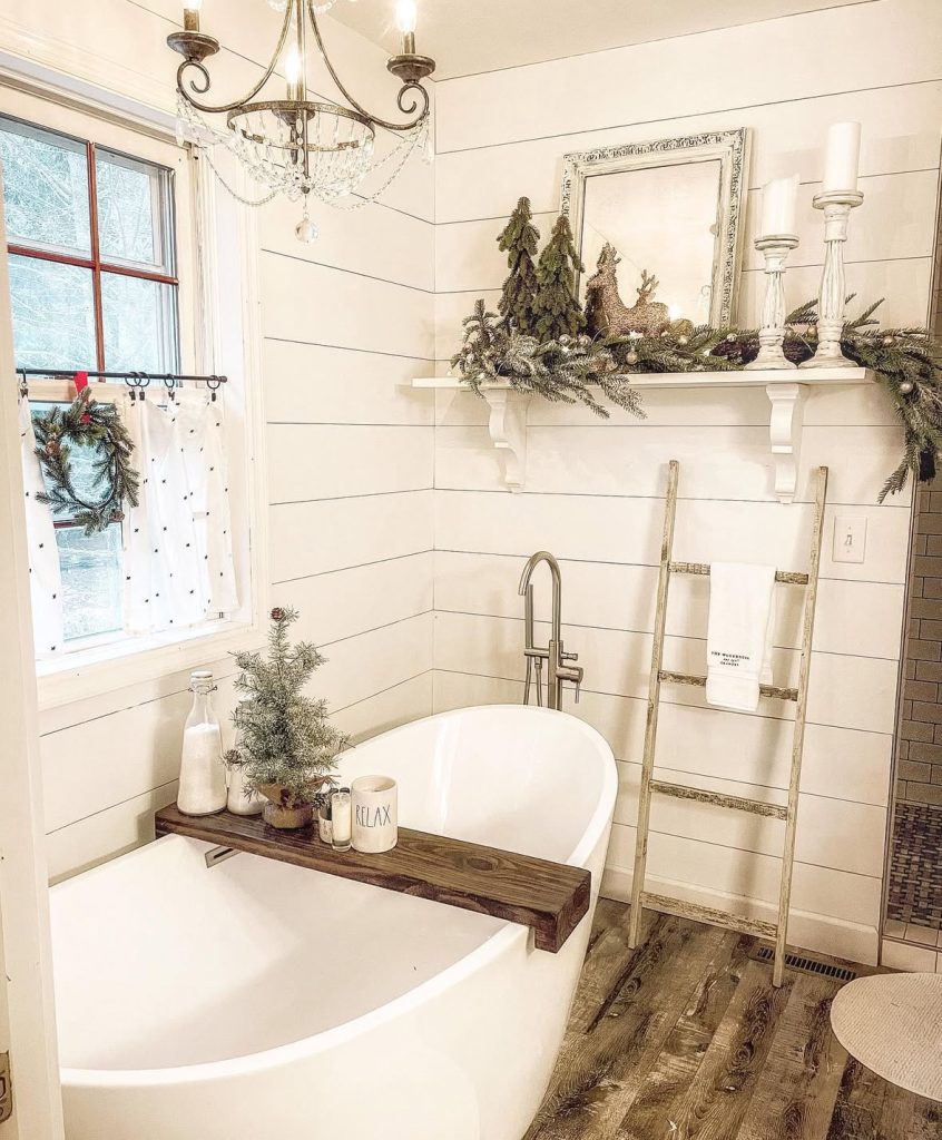 Farmhouse bathroom with Christmas decorations around the tub