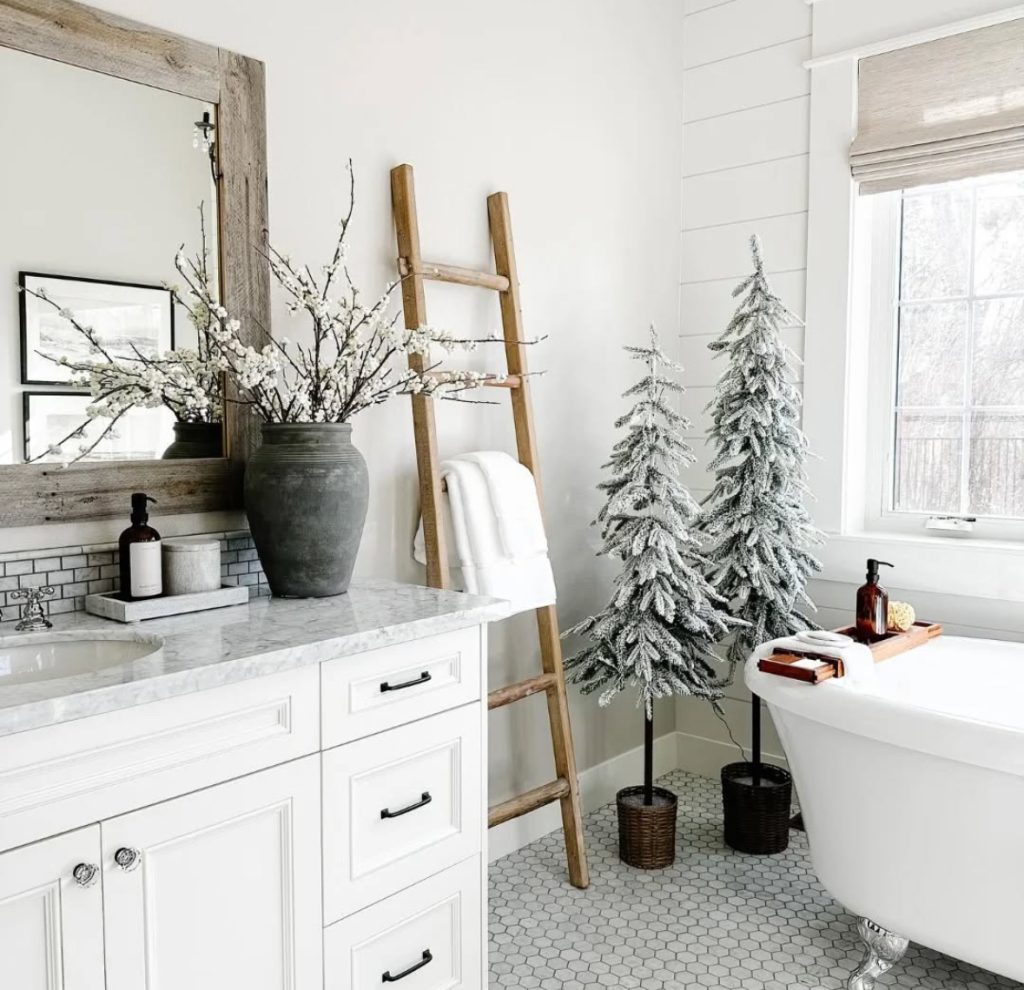 Bathroom decorated with frosted tabletop Christmas trees