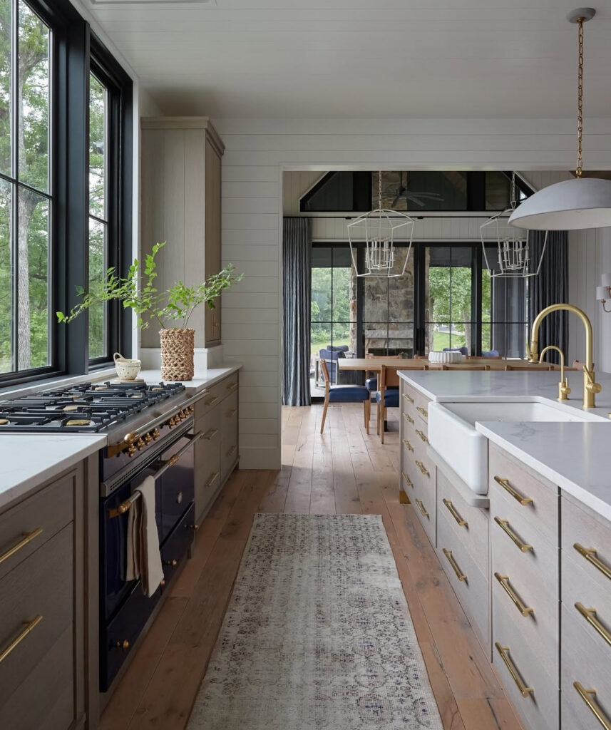 long galley configuration brass hardware farmhouse sink lodge views sophisticated rustic lake house kitchen