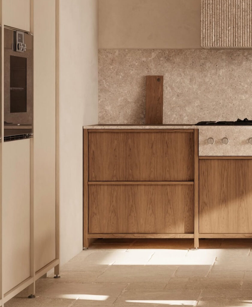 Japandi kitchen with a stone slab backsplash and smooth plaster walls.