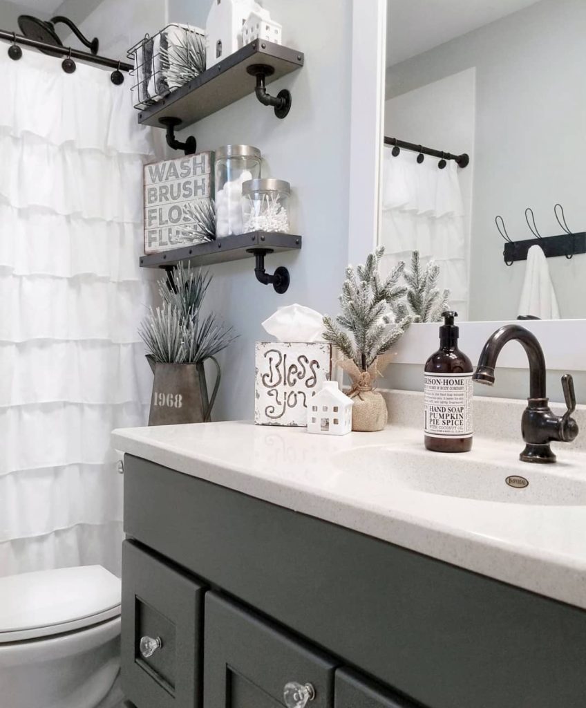 Pipe-style bathroom shelves decorated for Christmas